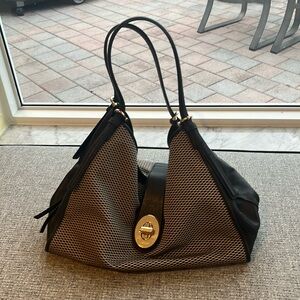 Coach handbag. Black and beige with gold hardware.